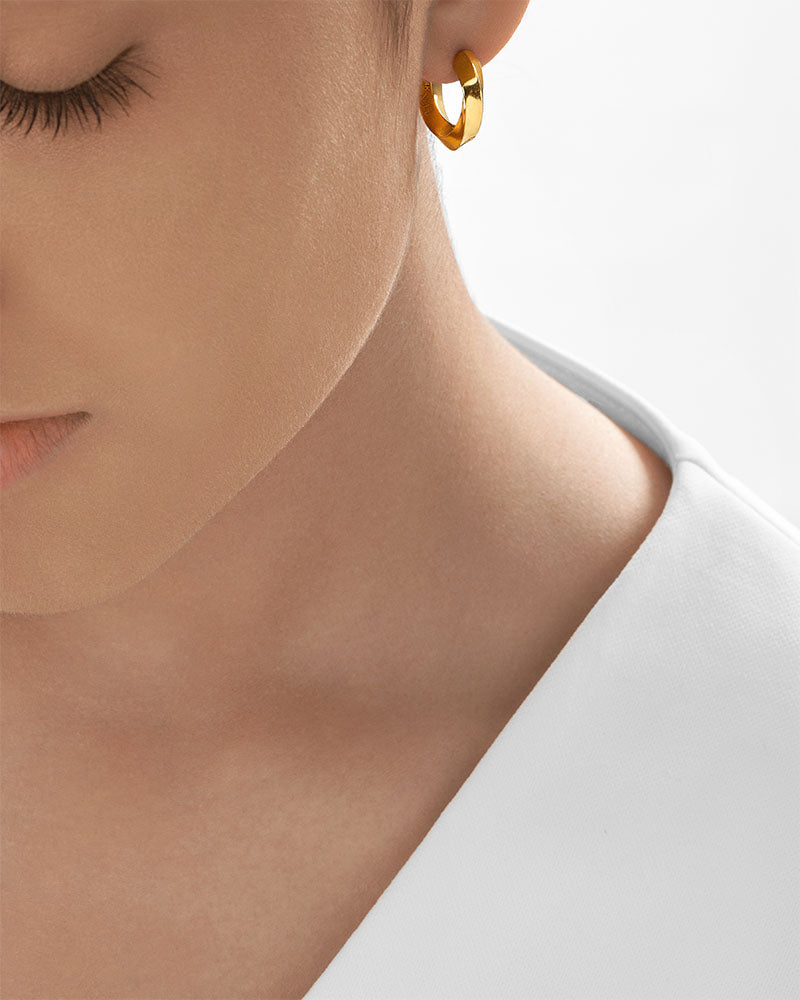 Chunky hoop earrings styled